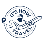 A circular logo with the words It's How I Travel, featuring an airplane, a location pin, and a silhouette of a head with a passport inside it, symbolizing meaningful travel and exploration.
