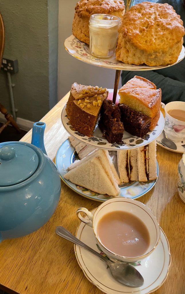 Afternoon Tea At The English Rose with sandwiches and scores