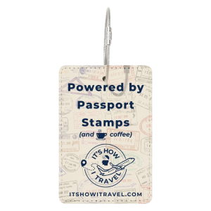 Luggage tag with It's How Travel logo and the words "Powered By Passport Stamps and coffee.