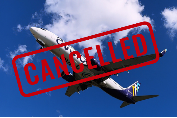 Avelo plane flying with a canceled stamp over the photo